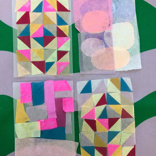 Layered tissue paper collage resembling stained glass in bright rainbow hues