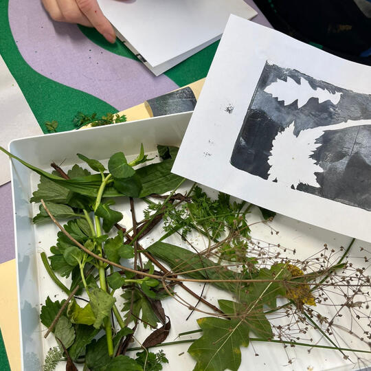 Bright neon paper collage in geometric shapes on brown cardboard