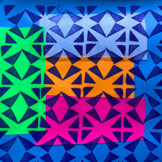 Bright background colours printed with triangular shapes on the top