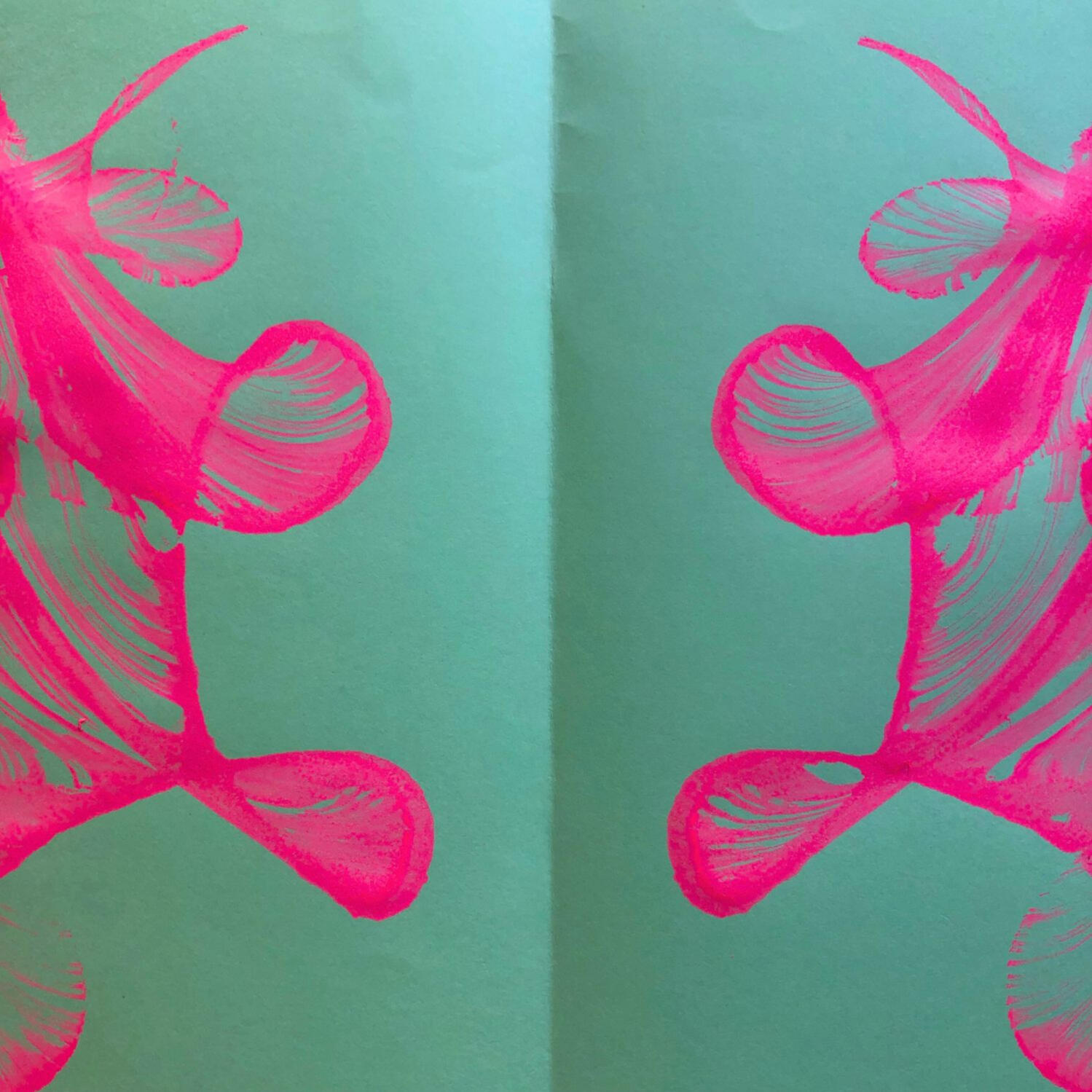 Adult and child hands creating colourful paper collages at a family arts and crafts workshop